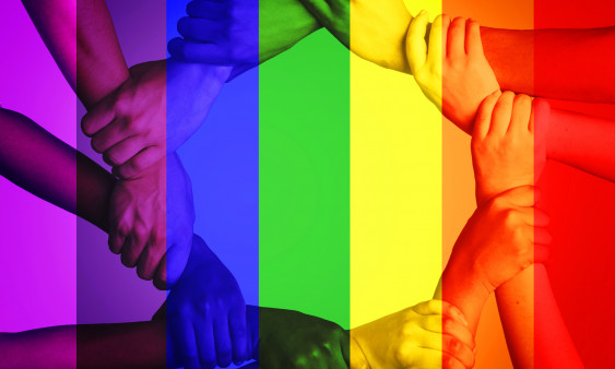 Multiple people's arms linking with a rainbow-colored overlay.