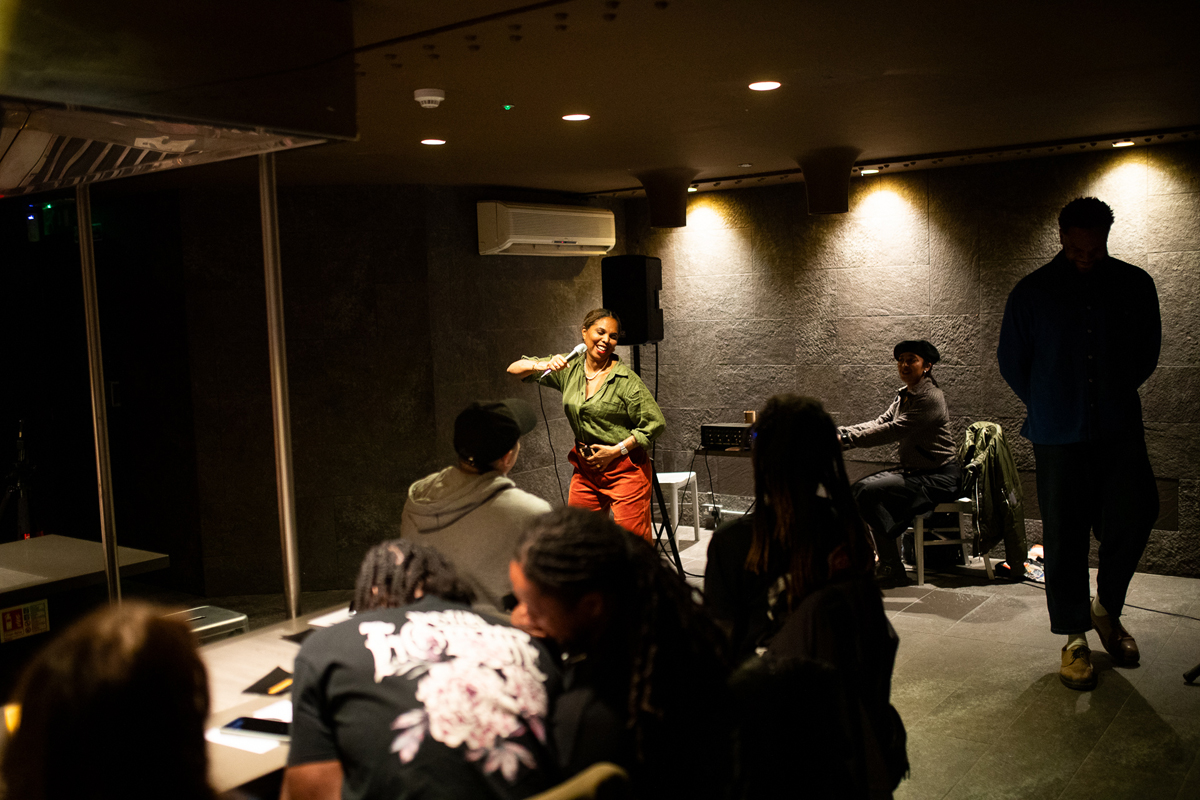 A Girl Like Me blogger Louise Vallace speaking to a group of people at an event.