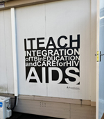 SIgn that reads ITEACH Integration of TB in Education and Care for HIV/AIDS.