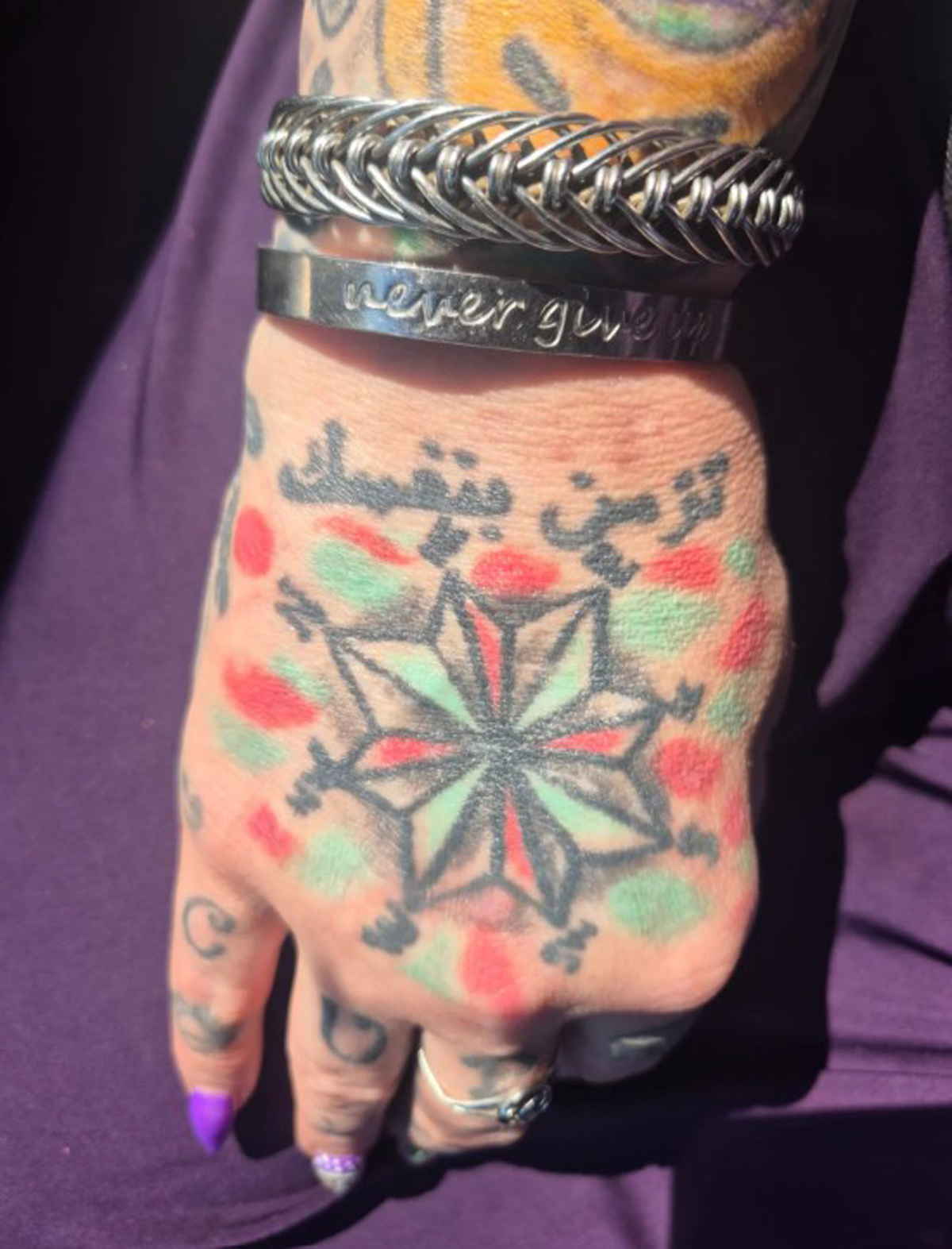 Back of Cupcake80's hand with bracelet on her wrist. 