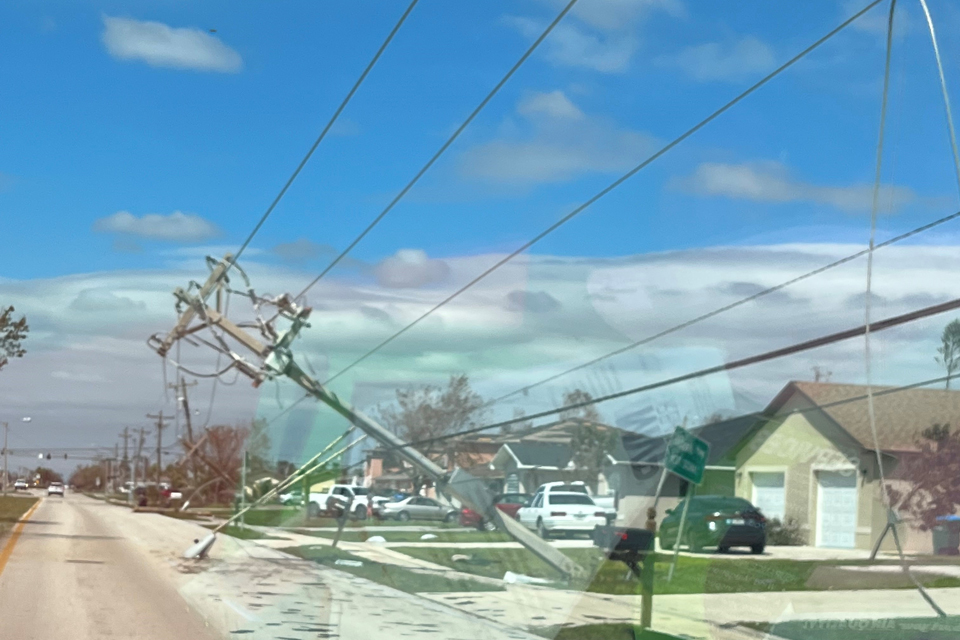 Damaged houses and downed powerlines.