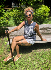 Louise Vallace sitting on a bench.
