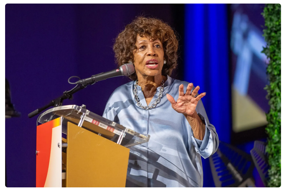 Maxine Waters speaking at a podium.