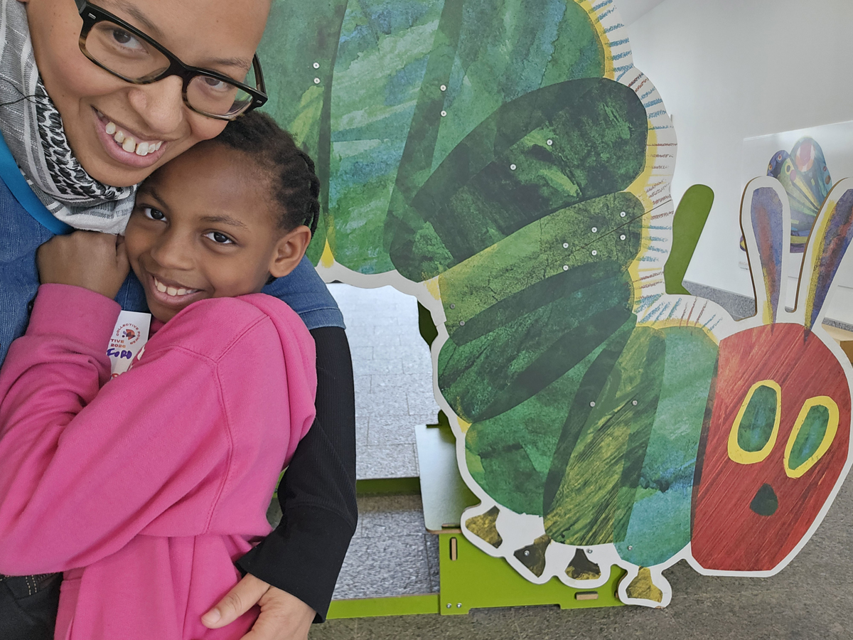Olivia, her kid, and the Very Hungry Caterpillar.