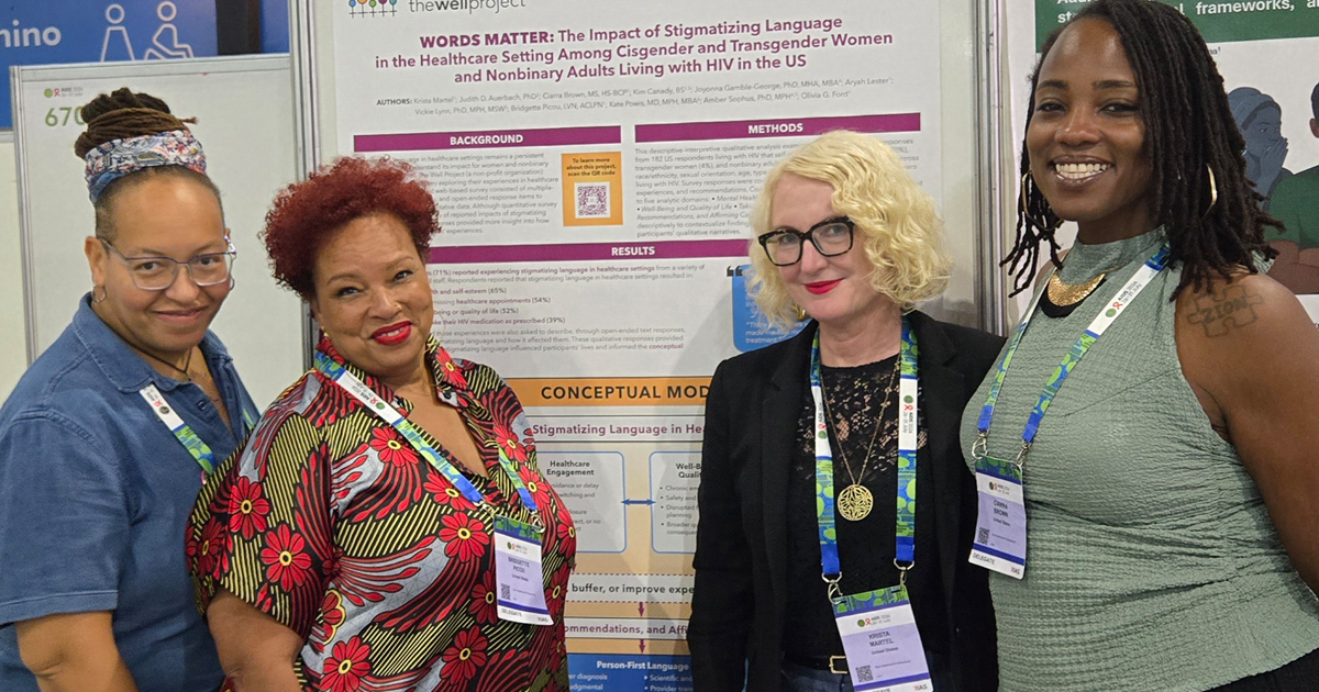 Members of The Well Project team, Olivia G. Ford, Bridgette Picou, Krista Martel, and Ciarra "Ci Ci" Brown with the Words Matter poster.