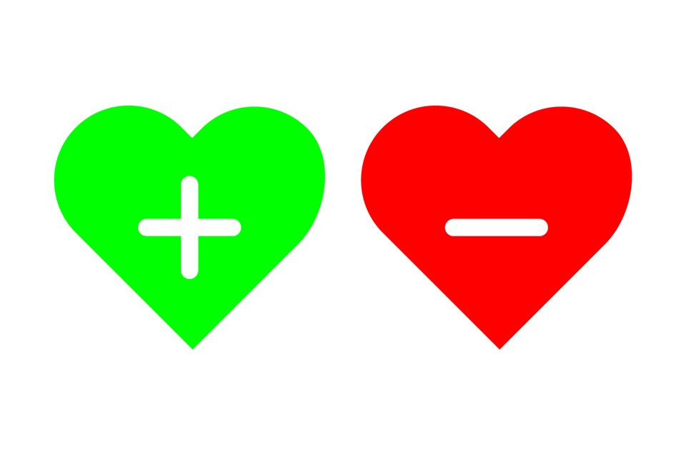 Green heart with a plus sign inside it next to a red heart with a minus mark inside it.