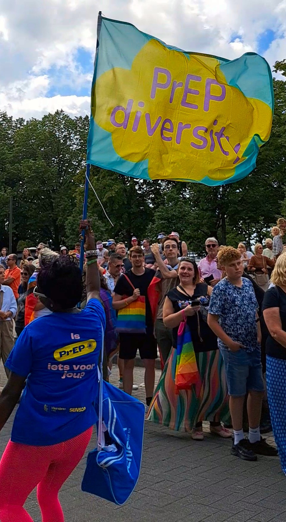 Eliane (HIVstigmafighter) holding a sign that reads &quot;PrEP Diversity&quot; at Antwerp Pride.