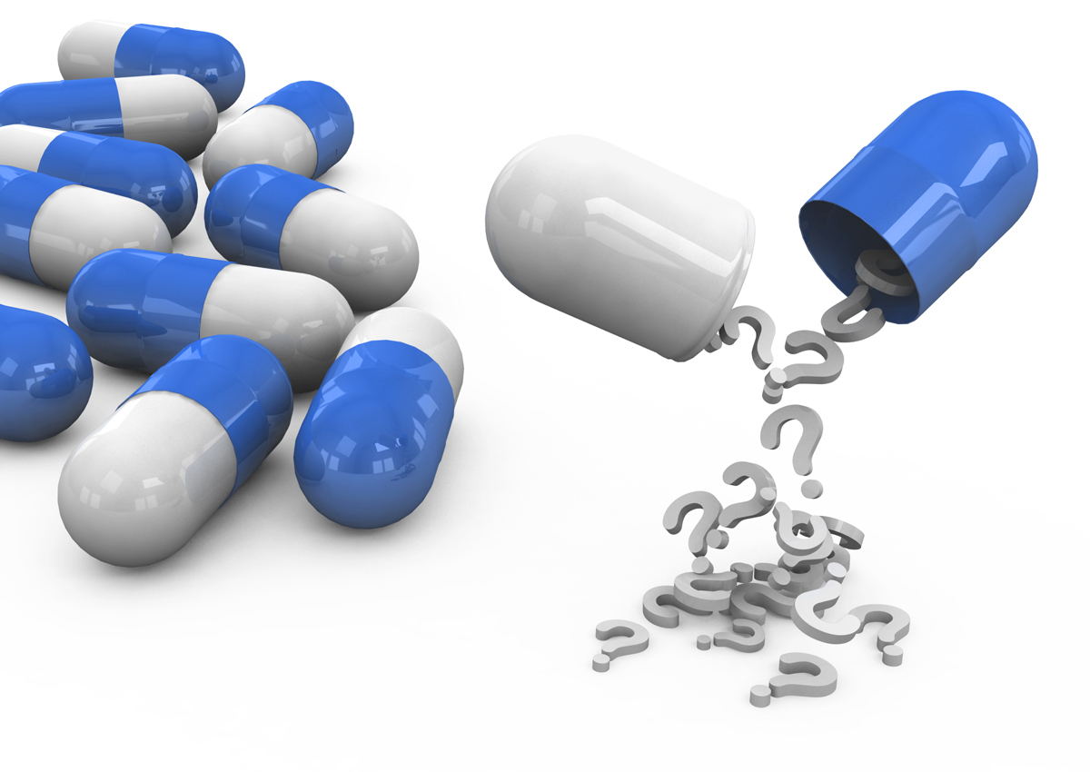 Several capsules, one with question marks spilling from it.