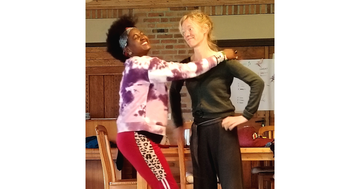 Blogger Eliane ("HIVStigmaFighter") laughing and another woman smiling.