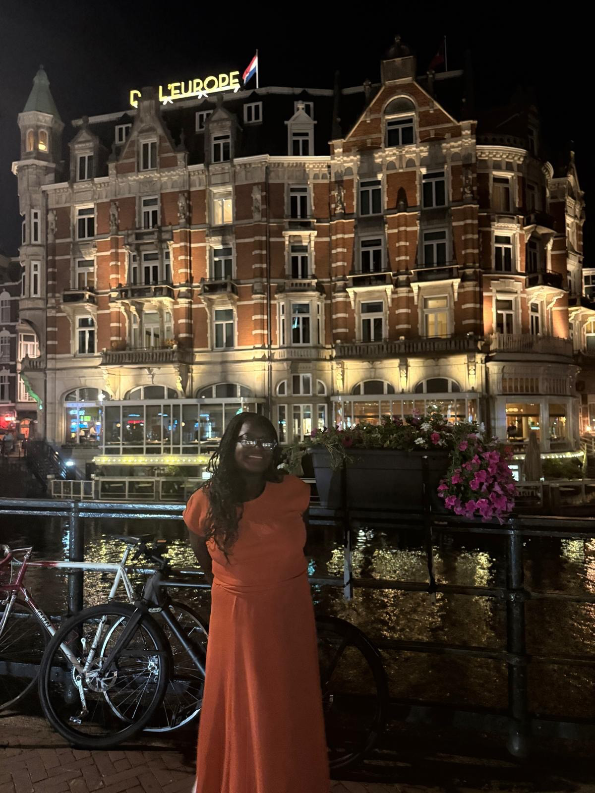 A Girl Like Me blogger "Nonsensical thinking" standing in front of a building at night.