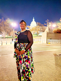 Marcya Gullatte with the United States Capitol Building in the background.