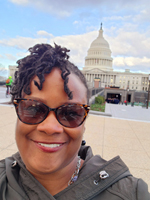 Marcya Gullatte with the United States Capitol Building in the background.