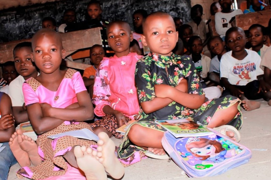 Children sitting on the floor.