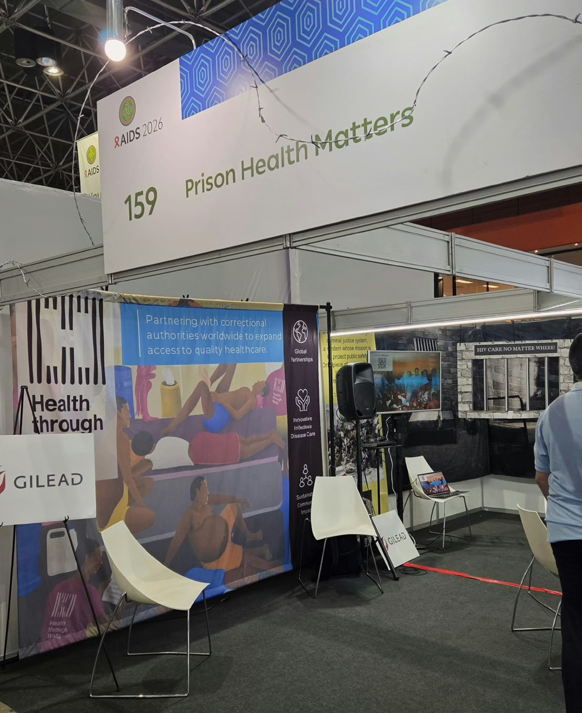 Booth and sign at AIDS 2026 reading "Prison Health Matters".
