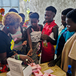 Eliane (HIVstigmafighter) distributing condoms.