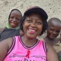 A Girl Like Me blogger Eliane ("HIVstigmafighter") with four children around her.
