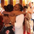 Tiffany Marrero and Gina Brown hugging at a New Orleans venue.