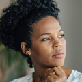 Woman looking to the side.