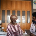 Two women, one in medical garb, seated, facing each other, with the words Conference Highlights.