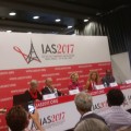Panelists at conference, sitting at a table in front of sign that reads "I A S 2017".