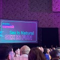 Crowd at 2023 Biomedical HIV Prevention Summit and screen that reads "Sex is Natural, Sex is Fun".