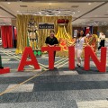 Marissa Gonzalez and others standing by a LATINX sign.