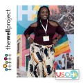 Ciarra "Ci Ci" Covin standing in front of USCHA sign.