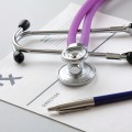 Stethoscope on medical notepad.