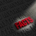 The word "FACTS" spotlighted in red letters surrounded by the word "MYTHS" in shadow all around it.