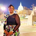 Marcya Gullatte with United States Capitol Building in the background.