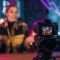 Woman talking in front of camera.