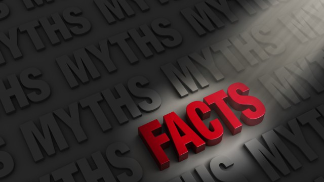 The word "FACTS" spotlighted in red letters surrounded by the word "MYTHS" in shadow all around it.
