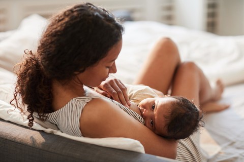 Woman breastfeeding an infant.